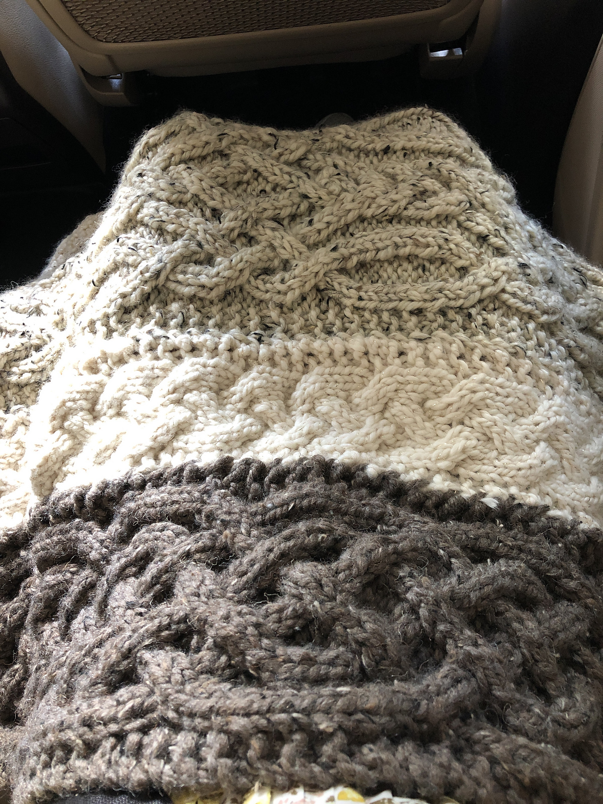 A lap blanket for my dad's birthday made by sewing together several strips of knitted Celtic cables (it is only half-done in this photo, oops!).